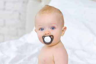 Baby Chewing on Pacifier