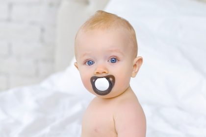 Baby Chewing on Pacifier